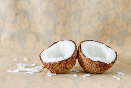 Coconut on natural brown background with copy space