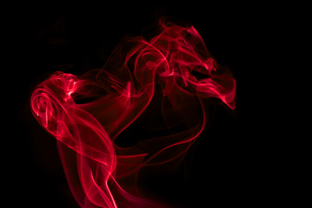 red smoke on black backgroundの写真素材