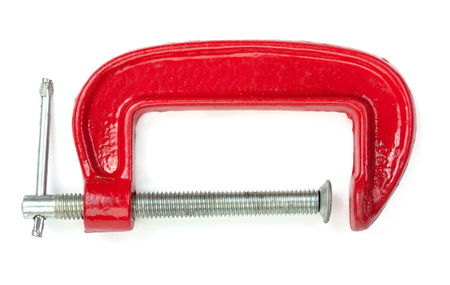 Red clamp for woodworking isolated on a whiteの写真素材