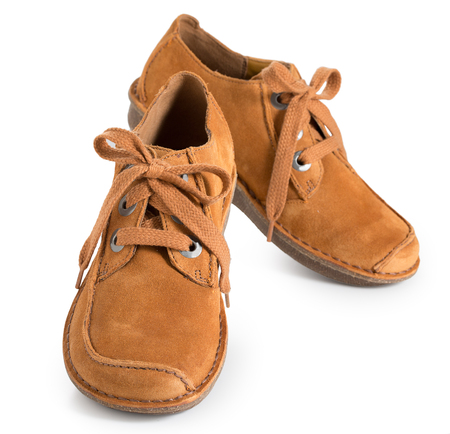 Pair of fashion stylish chamois leather shoes for women, isolated on a white background close up.