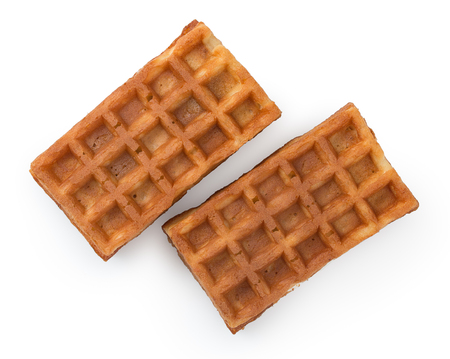Pair of fresh soft belgian waffles isolated on white background. Top view, close up.の写真素材
