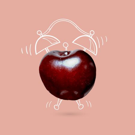 Creative idea layout cherry alarm clock on pink background.