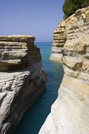 Limestone rocks on Corfu island with sea in the background