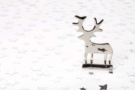 Metal reindeer with stars on floor and backgroundの写真素材