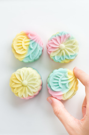 Chinese dessert with hand の写真素材