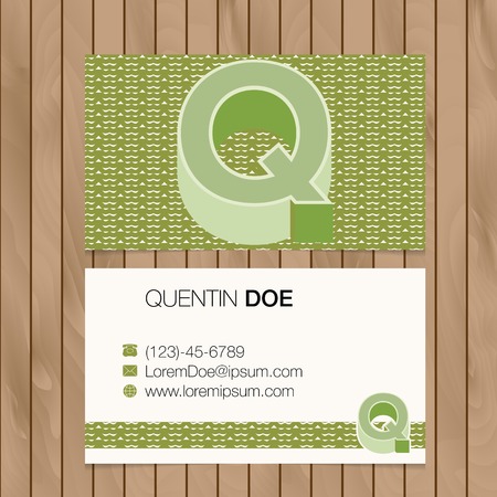 Business card with alphabet letter on a wood background. Vector template editableのイラスト素材