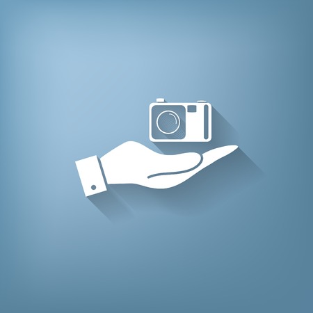 hand holding a photo cameraのイラスト素材