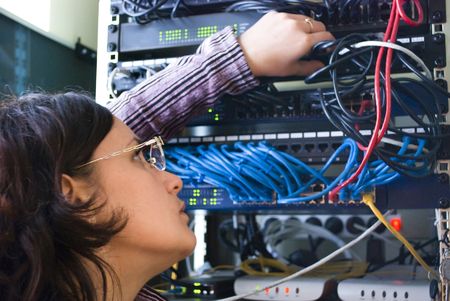 young woman repairs computer hardwareの写真素材