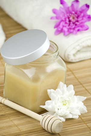 relaxing aroma of almond coconut vanilla milk and honey bath foam over wooden matの写真素材