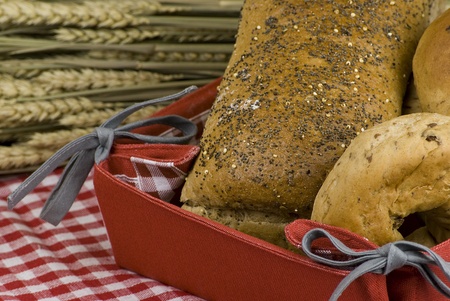 variety of different freshly baked bread in basketsの写真素材