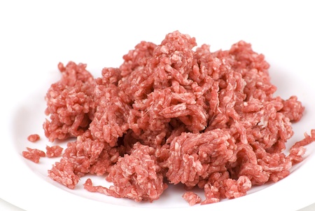 pile of fresh raw beef mince in white plate