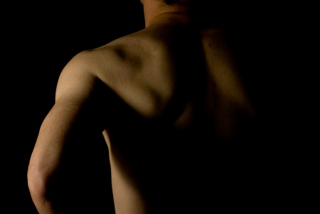 sexy fit naked male body on black background low keyの写真素材