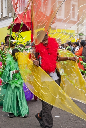 LONDON - AUGUST 27: Dancers at the annual Notting Hill Carnival on August 27, 2012 in Notting Hill, London.のeditorial素材