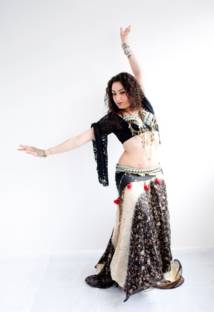 exotic young belly dancer, oriental dance isolated on white backgroundの写真素材