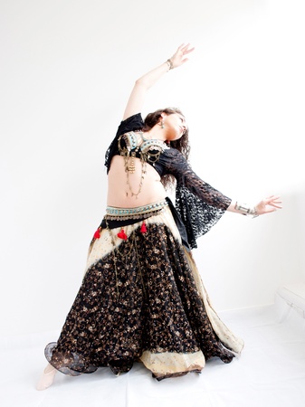 exotic young belly dancer, oriental dance isolated on white backgroundの写真素材