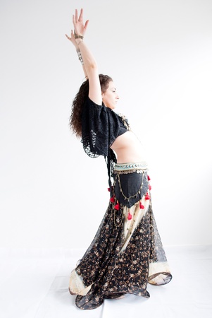 exotic young belly dancer, oriental dance isolated on white backgroundの写真素材