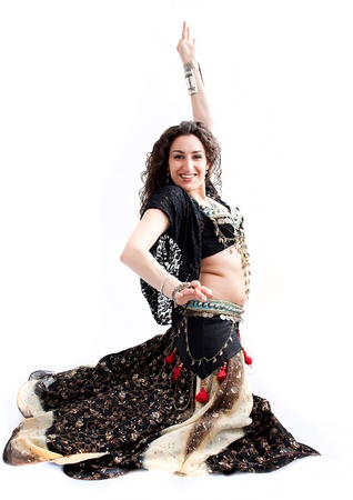 exotic young belly dancer, oriental dance isolated on white backgroundの写真素材