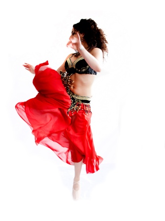 exotic young belly dancer, oriental dance isolated on white backgroundの写真素材