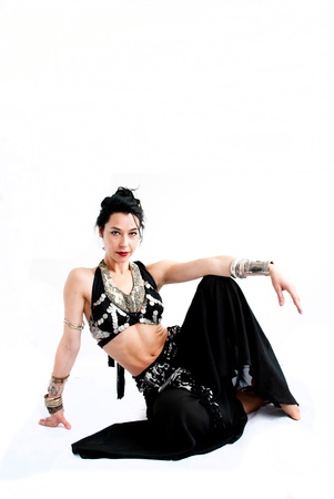 exotic young belly dancer, oriental dance isolated on white backgroundの写真素材
