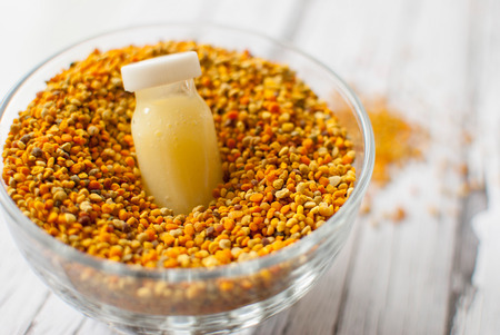 raw organic royal jelly in a small bottle