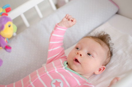 little cute baby girl playing in a cotの写真素材