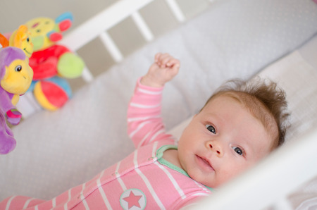 little cute baby girl playing in a cotの写真素材