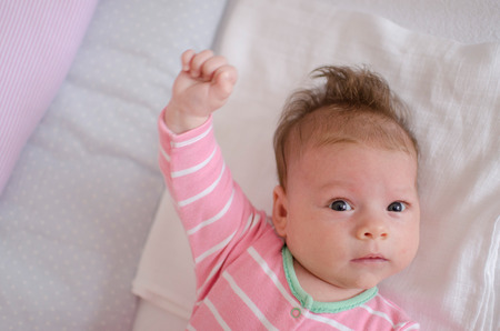 little cute baby girl playing in a cotの写真素材