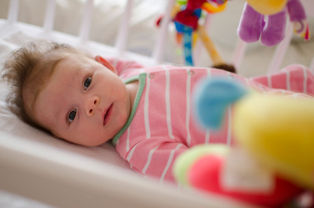 little cute baby girl playing in a cotの写真素材