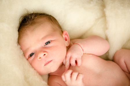 beautiful newborn baby girl sleeping peacefullyの写真素材