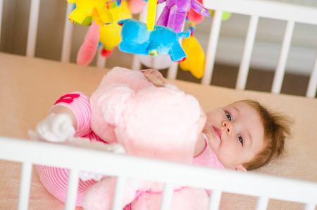 little cute baby girl playing in a cotの写真素材