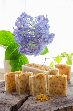 homemade calendula and tea tree herbal natural soap using olive oil shea and cocoa butterの写真素材