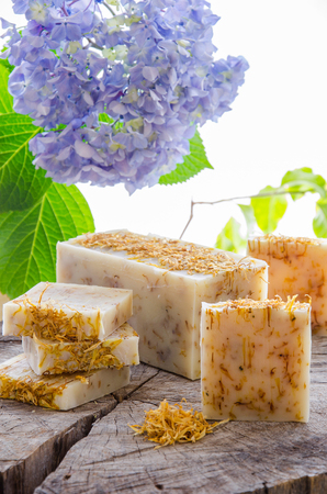 homemade calendula and tea tree herbal natural soap using olive oil shea and cocoa butterの写真素材