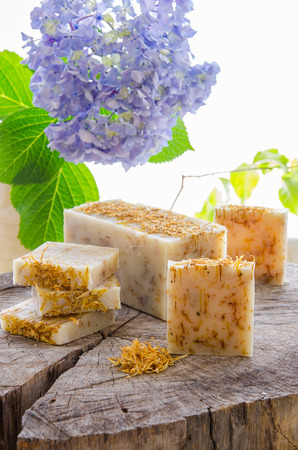 homemade calendula and tea tree herbal natural soap using olive oil shea and cocoa butterの写真素材