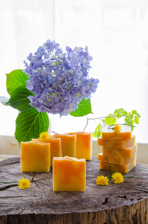 homemade orange and dandelion herbal natural soap using olive oil shea and cocoa butterの写真素材