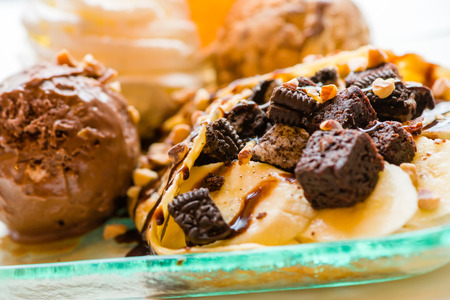 tasty pancakes with chocolate ice cream crispy waffle whipped cream with brownies cherry almond and chocolat syrup on top.served pancakes crepes on plate.sweets dessert brownies pancakes crepes.の写真素材