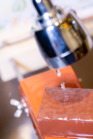 woman professional chef hands hold knife for whetting on whetstone.premium professional stone from japan.knife sharpening process with traditional sharpener stone for knife sharpen edge in restaurant.の写真素材