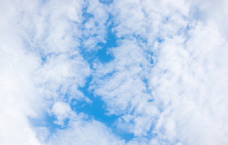clear blue sky with white clouds on good weather.blue sky on sunlight background.skyscape.cloudscape.beautiful vast blue sky and fluffy clouds with some space.の写真素材