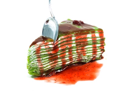 spoon on crepe cake with white isolated backgroundの写真素材
