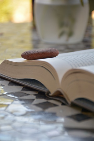 open book with a stone paperweightの写真素材