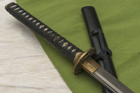 Japanese traditional samurai damask sword on the background