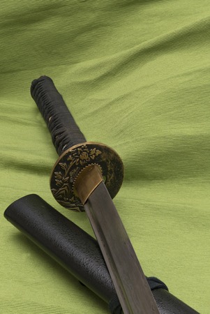 Japanese traditional samurai damask sword on the backgroundの写真素材