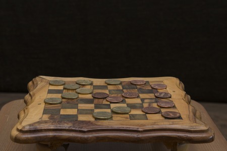 game of checkers - US cents VS euro cents