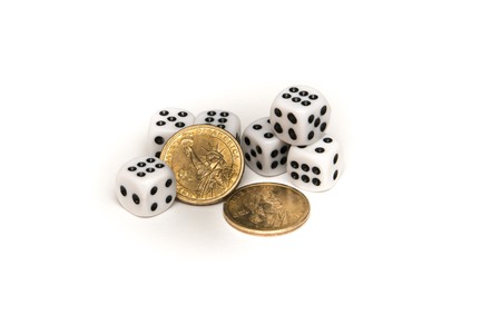 dices and two commemorative american dollars on a white backgroundの写真素材