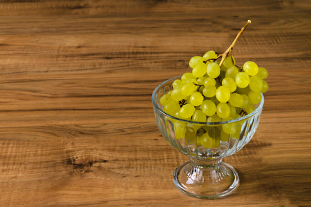 Fresh ripe grapes on the wooden table, rustic styleの写真素材