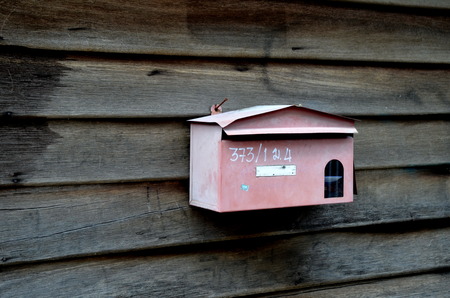 Mailbox hanging on old wood wall, Bangkok, Thailandのeditorial素材