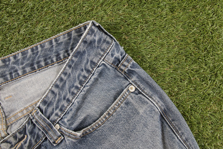 Blue jeans on a Artificial Grass background