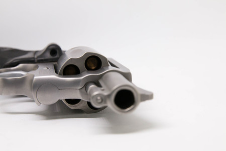 close-up a handgun with bullets isolated on white backgroundの写真素材