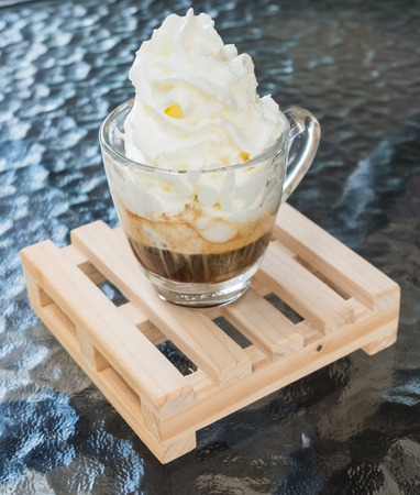 Coffee cream on wood plnkの写真素材