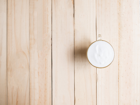 Coffee cream on Wood texture backgroundの写真素材