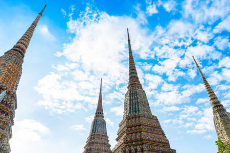Ancient Thai temple with blue sky background at Bangkok, Thailandの写真素材